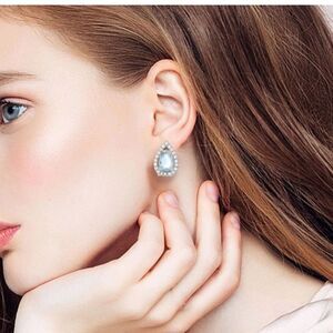 Blue Topaz Tear Drop hinge closure silver earrings